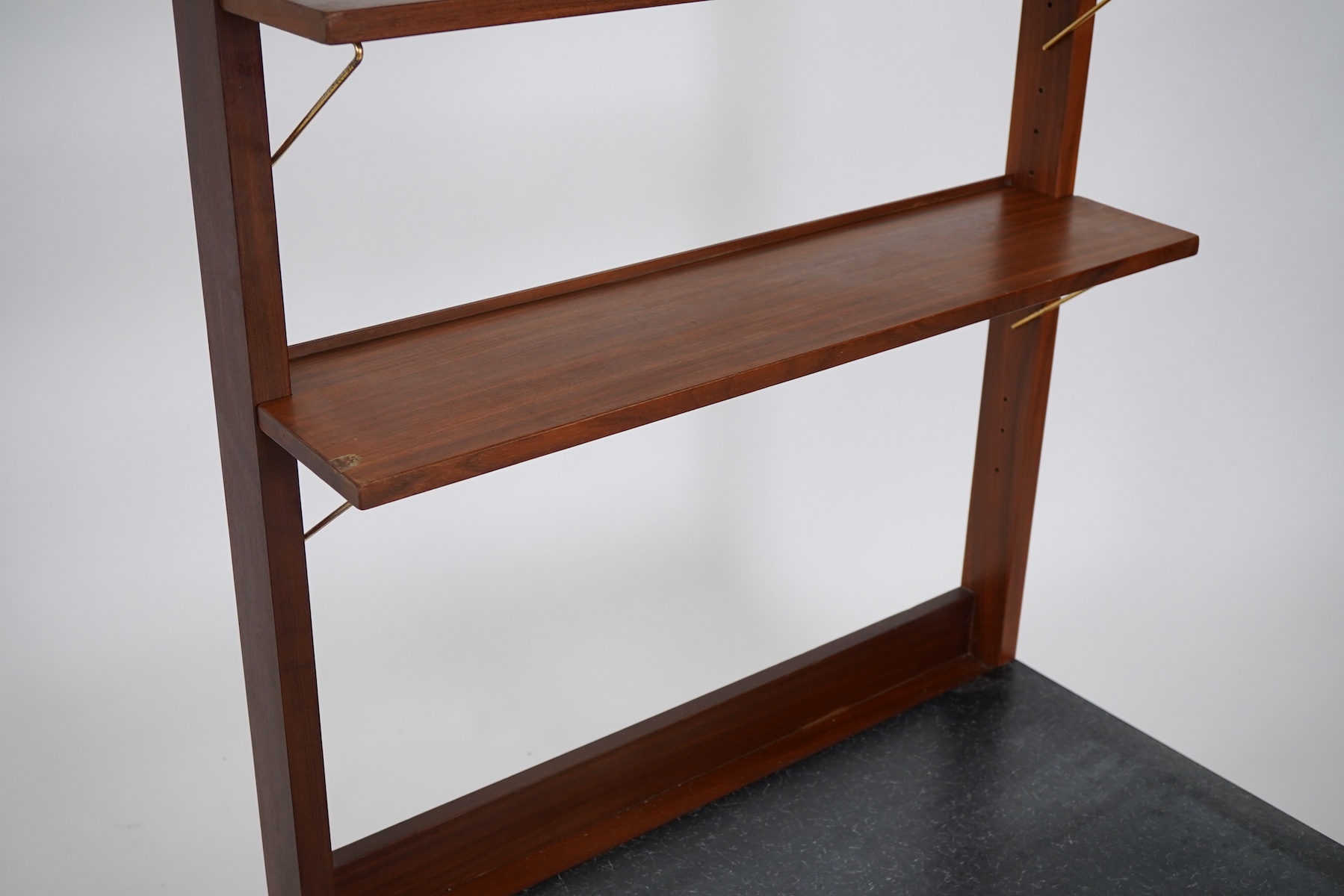 George Fejér (Hungarian, 1912-1996) for Guy Rogers of Liverpool: A 'Beverly Hills' mid-century hall stand shelving unit and matching occasional table